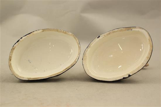 A pair of English porcelain figures of seated hounds, c.1830, 11.5cm and 12.5cm, flaking to enamels